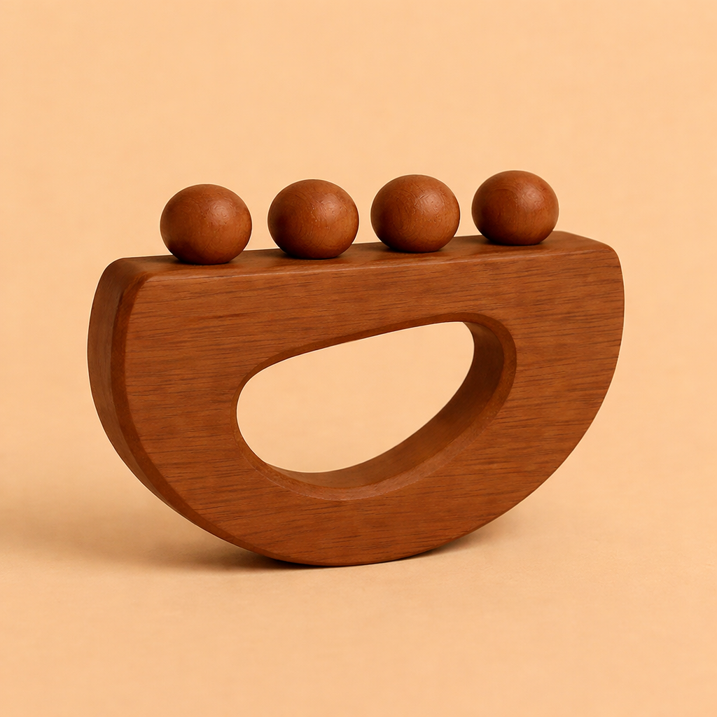 Wooden sculpture with four spherical protrusions on a beige background